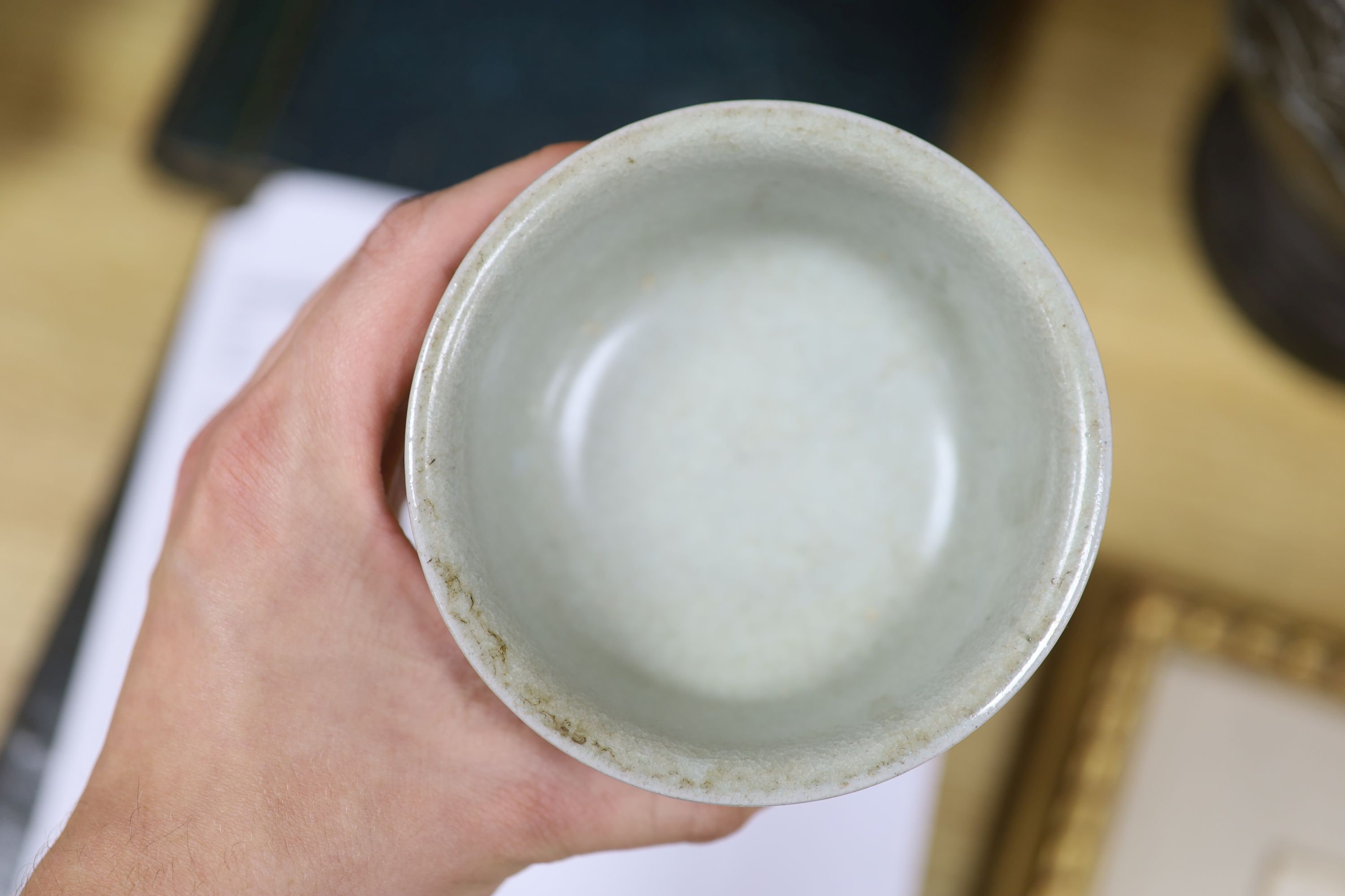 A Chinese blue and white bowl, diameter 15cm, a tea bowl and saucer, a crackleglaze shell dish and a celadon glazed stem cup